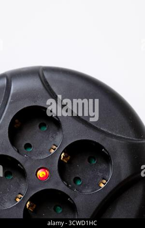 Rolled extension with a red light indicator signals Stock Photo