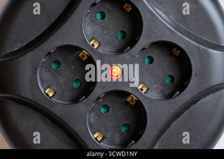 Rolled extension with a red light indicator signals Stock Photo