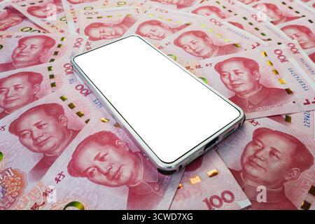 white smartphone screen on Chinese yuan banknotes background for design purpose. a blank screen on a smartphone with money. Stock Photo
