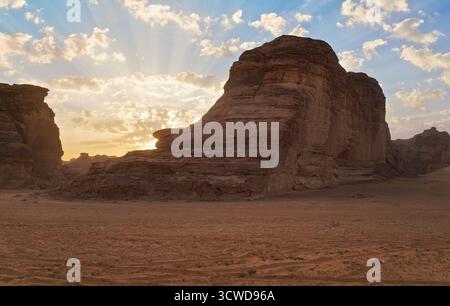 Morning sun shines over rocky desert formations, typical landscape in Al Ula, Saudi Arabia Stock Photo
