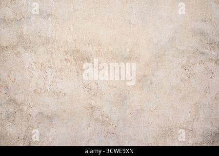 Neutral abstract background. Light beige texture of old plastered surface. Stock Photo