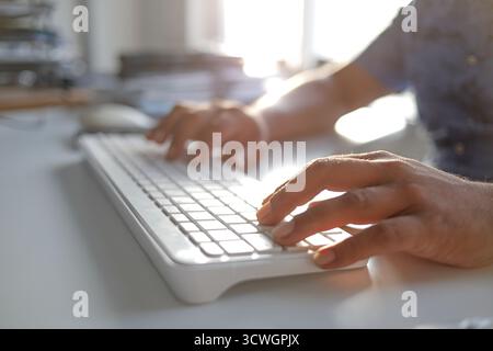 Man typing laptop and using smartphone for online shopping and paying by credit card, Online payment and shopping concept. Stock Photo