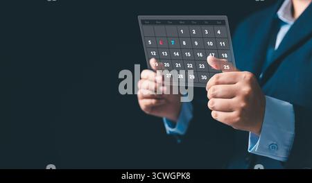 Using digital technology, business set strategic agenda by managing appointment, scheduling project task, organizing timeline, date, deadlines calenda Stock Photo
