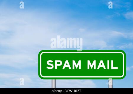 Green color transportation sign with word spam mail on blue sky with white cloud background Stock Photo