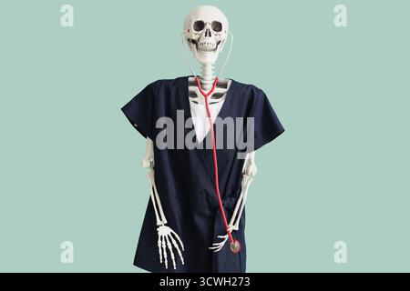 Human skeleton in black medical uniform with stethoscope on turquoise background Stock Photo