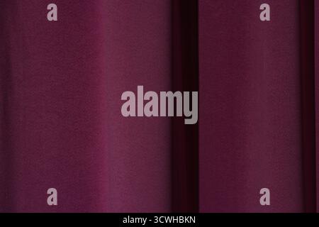 Abstract Texture of Deep Magenta Draped Fabric or Curtains Stock Photo