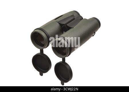 Modern green military-style binoculars with black rubber lens caps hanging down, isolated on white. Stock Photo