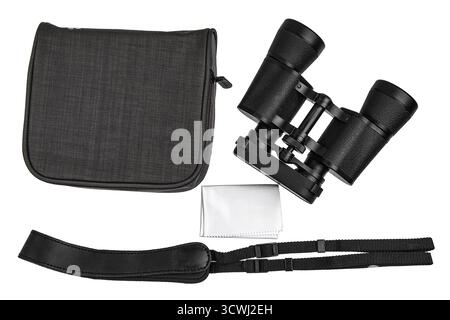 A set of black binoculars with a carrying case, neck strap, and lens cloth on white. Stock Photo
