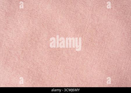 Soft pink cashmere sweater texture background. Top view. Stock Photo