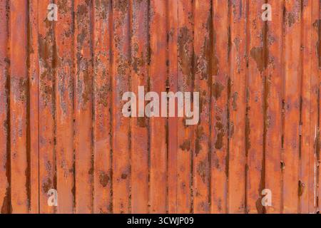 Rusty vertical corrugated metal sheet Stock Photo