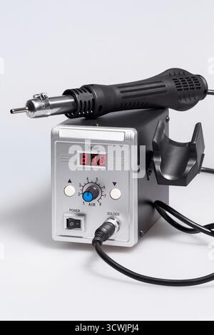 A modern digital hot air soldering station. Close-up on a white background. Stock Photo