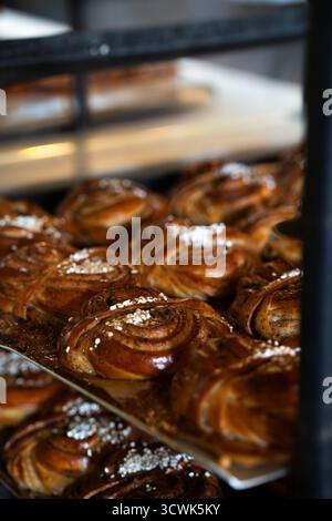 Freshly baked Swedish cinnamon buns on a tray for a fika Stock Photo