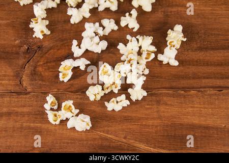 Popcorn on a rustic wooden table in the foreground with copy space Stock Photo