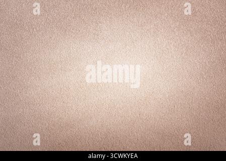 Background of beige suede leather. Beige suede vignette Stock Photo