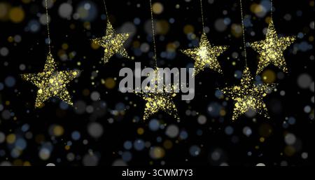 Image of golden stars over light spots on black background Stock Photo