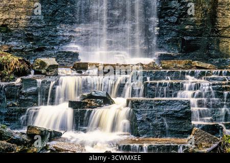 Waterfall with flowing water on the rocks Stock Photo