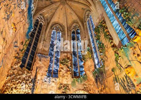 Beautiful interior in palma cathedral with dark painted windows and illuminated walls Stock Photo