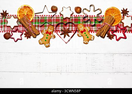 Festive Gingerbread Cookies with Spices and Cookie Cutters Stock Photo