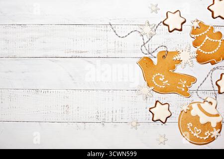 Iced Christmas Cookies on White Rustic Wood Background Stock Photo