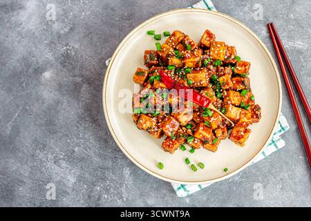Stir-Fried Tofu in Soy Garlic Sauce, Vegan High-Protein Food Photo Stock Photo