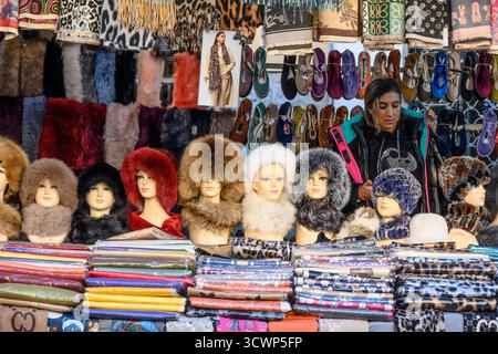 A stall selling fur hats and scarves in the Rastro flea market on  the Calle de la Ribera de Curtidores between La Latina and Embajadores, Madrid, Spa Stock Photo