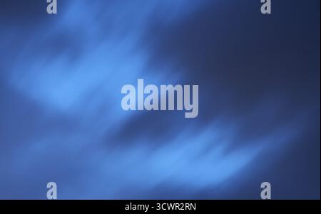 blurry dark rain cloud floating on sky at sunset in evening Stock Photo