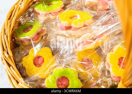 Wrapped Easter Cookie Sandwiches in Basket Stock Photo