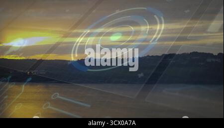 Displaying translucent circular HUD graphic overlaying sunset lake, with golden water reflections Stock Photo