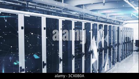 Displaying server racks showing blinking lights in data center corridor, with overhead cable trays Stock Photo
