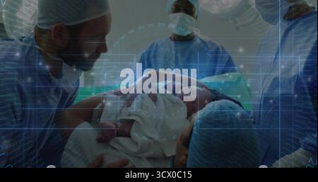 Placing newborn infant wrapped in hospital blanket on mother chest in operating suite, with drapes Stock Photo