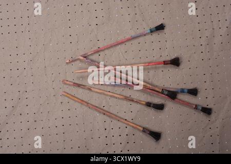 Paint brushes on technique ebru art on paper background Stock Photo