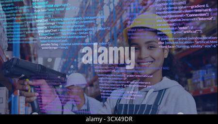Scanning Hispanic worker in hard hat pointing scanner at packages in warehouse with code overlays Stock Photo