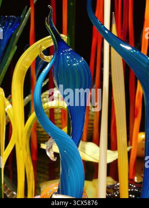 SEATTLE - APR 25, 2025 - Colorful hand-blown glass sculpture showcasing swirling abstract forms, radiating artistic brilliance and transforming interi Stock Photo