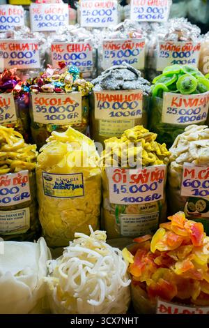 January 23, 2018 - Ho Chi Minh City, Vietnam: Brightly colored dried fruits are displayed in bags at Ben Thanh Market in Ho Chi Minh City, Vietnam sho Stock Photo