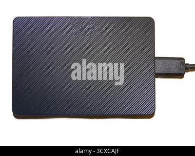 External hard drive with cable isolated on white Stock Photo