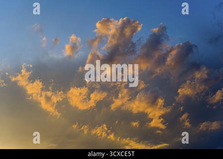 Dramatic clouds in the light of a sunset, colourful and atmospheric, Ararat Province, Armenia Stock Photo