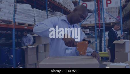 Sealing warehouse worker using tape dispenser at packing station, with supervisor checking tablet Stock Photo