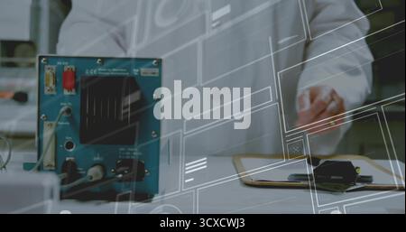 Lab technician wearing white coat adjusting instrument in lab, with cables connectors clipboard pen Stock Photo