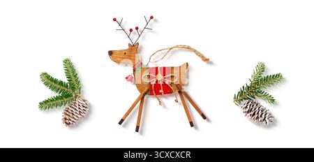 Wooden Reindeer Ornament with Pine Branches and Snow Cones Stock Photo