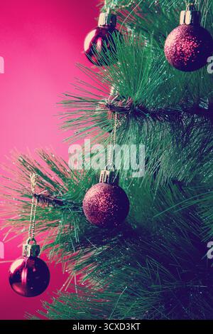 Red Christmas Balls on Christmas Tree on Red Background Stock Photo
