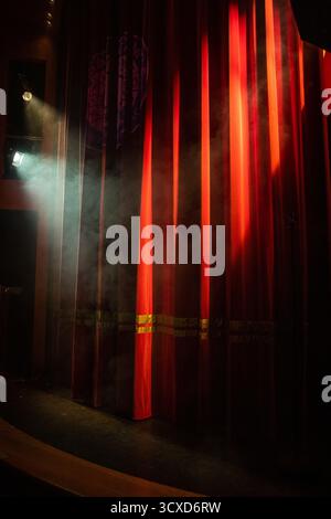 The red curtain on the stage of the Magic Circle theatre Stock Photo