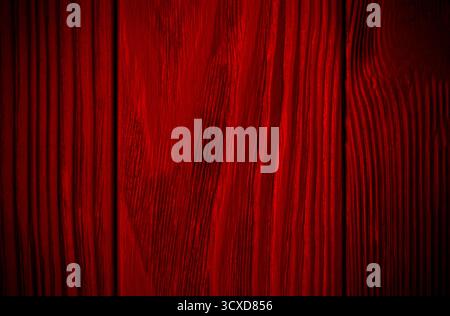 Red wood texture background. Abstract dark texture on red wall. Stock Photo