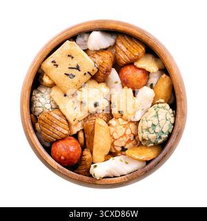 Japanese rice crackers, in wooden bowl. Assorted varieties of Arare crackers made from rice flour. Stock Photo