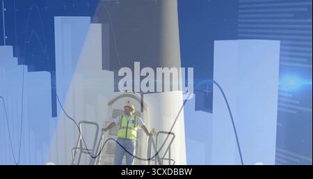 Inspecting technician wearing helmet, vest and gloves on wind turbine platform, with data overlays Stock Photo
