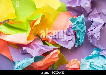 Wallpaper and background made from crumpled torn and colorful pieces of paper Stock Photo