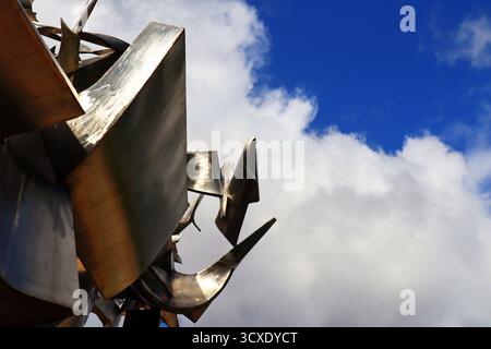 abstract metallic sculpture against blue sky Stock Photo