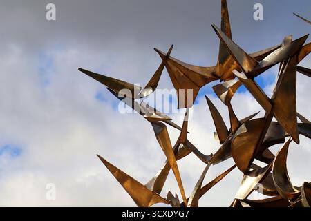 abstract metallic sculpture against blue sky Stock Photo