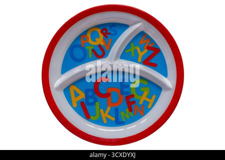 childs Melamine plate with letters of the alphabet on isolated on white background Stock Photo