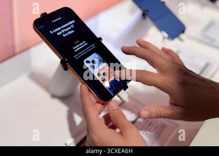Close up of female hands trying the new iPhone 17 Pro smartphone in the store Stock Photo
