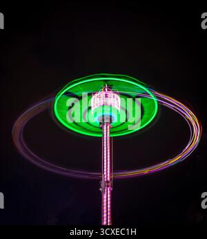 Shot of the light trails from carousel attraction made on long exposure Stock Photo